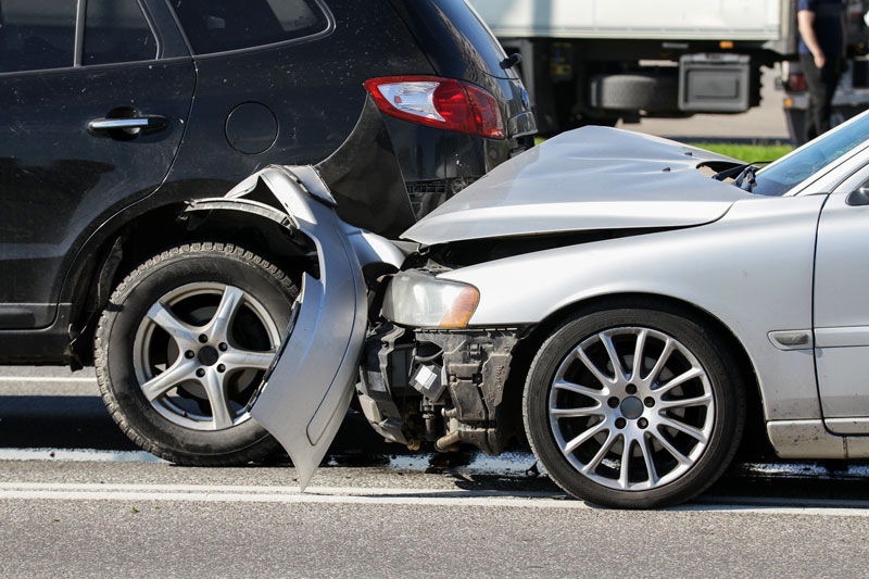 two cars crashed covered by Auto Insurance in Saginaw, MI