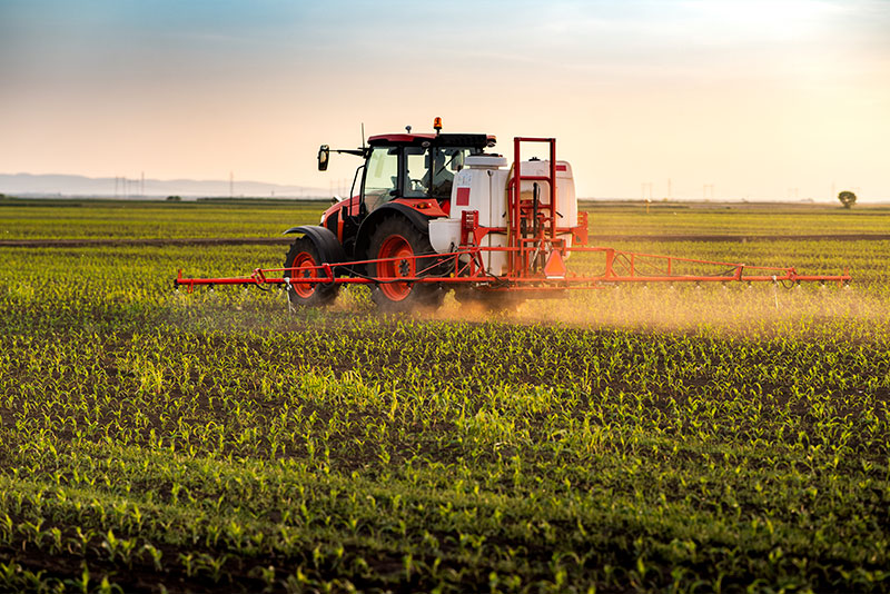 Farm Machine working with Crops covered by Farm Insurance and Business Insurance in Saginaw, Michigan